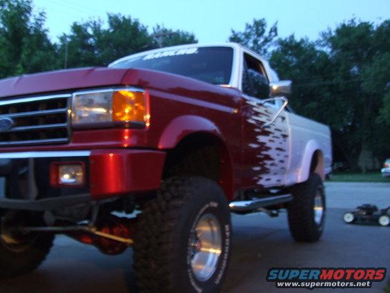 Red and white pickup truck with custom paint, 3q-front view