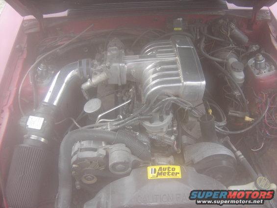 engine bay with chrome intake manifold and air filter