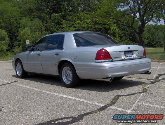 Silver 2002 Ford Crown Victoria, rear 3/4 view. License plate MAC108