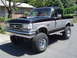 1989 Ford Bronco - This lifted 1989 Ford Bronco features a black and silver two-tone paint scheme and BFGoodrich Mud-Terrain T/A tires.
