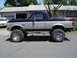 1989 Ford Bronco - This lifted Ford Bronco has a two-tone paint scheme and BFGoodrich Mud-Terrain T/A tires.