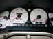 1994 Ford Probe - A car's interior shows the instrument cluster with a speedometer and tachometer.