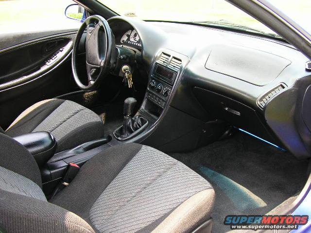 Interior of a 1994 Ford Probe GT, showing the dashboard, seats, and gear shifter