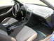 1994 Ford Probe - The interior of a 1994 Ford Probe GT is captured, highlighting the driver's side controls and passenger seating.