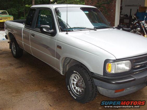 Silver 1994 Mazda B3000 pickup truck parked outside
