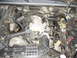 1994 Mazda B3000 - Close-up view of a vehicle's engine compartment, showing various mechanical components.