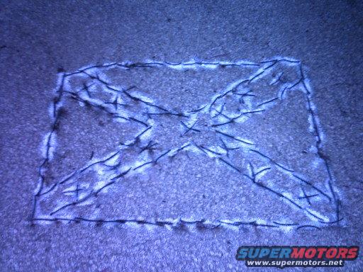Drawing on pavement with SUPERMOTORS.NET watermark