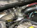 2000 Ford F-250 - Close-up view of engine components, including turbocharger and intake piping, with a visible 'Cold side only' label.