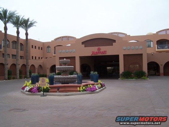 Marriott hotel entrance with fountain and palm trees