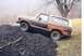1979 Ford Bronco - This 1978 Ford Bronco is captured in a three-quarter front view as it ascends a mound of coal.