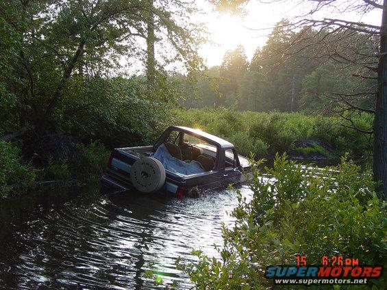 1995 Dodge 1500 stuck in a creek with the rear end submerged