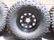 1996 Jeep Grand Cherokee - Close-up of Mickey Thompson Baja MTZ radial tires and black rims.