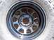 1996 Jeep Grand Cherokee - A chrome wheel with a Mickey Thompson Baja Radial tire is shown in a close-up view.
