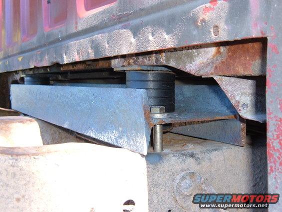 Custom body mount with rubber isolators and metal bracket