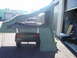 1991 Ford Bronco - A trailer with an attached tent is set up in an outdoor storage area.