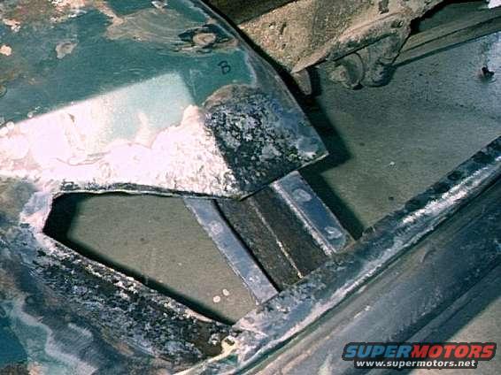 Passenger Side - Rusted out areas beyond replacement floor pan.