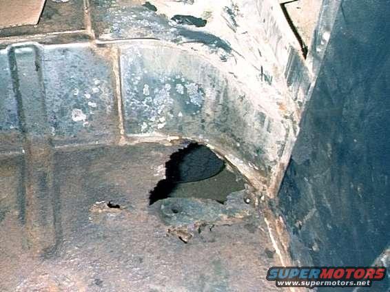 Drivers side, rusted corner area.