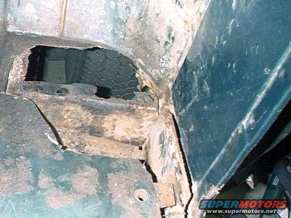 pict0067.jpg Driver's side corner, rusted areas cut out.