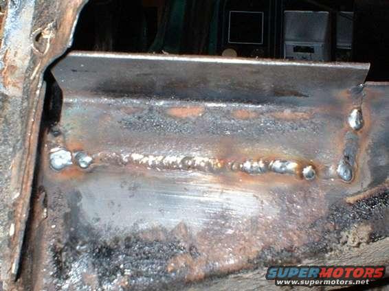 oct00011.jpg Driver's side, rollcage crossmember repaired.