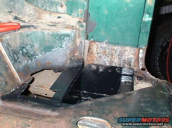 Driver's side, rollcage crossmember repaired and painted.