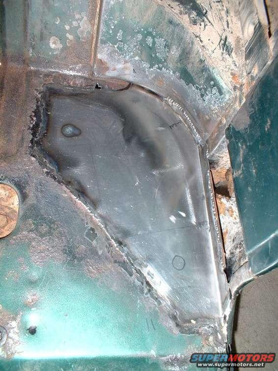 Driver's side, patch made over rusted floor area.