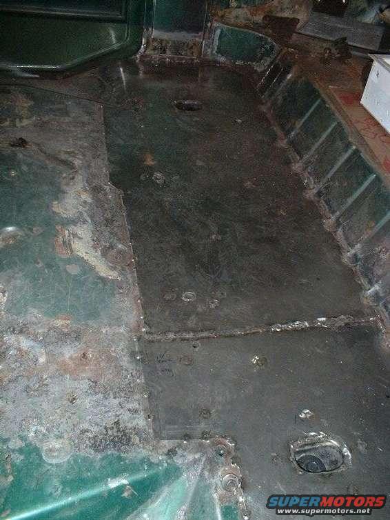 Sheet metal (18 gauge) laid over thinning steel floor.