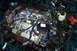1995 Ford Taurus - A complex engine bay with numerous wires and components, suggesting a recent repair or modification.
