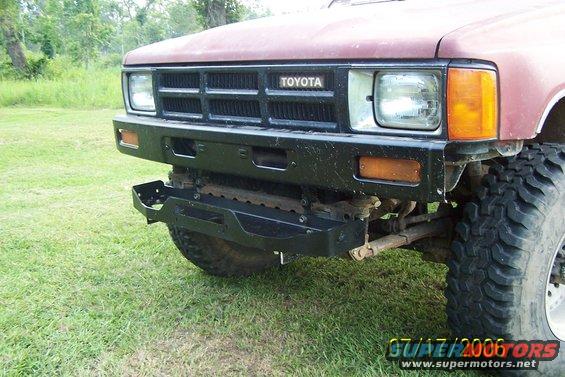 Red 1984 Toyota 4Runner front view with aftermarket bumper and large tires