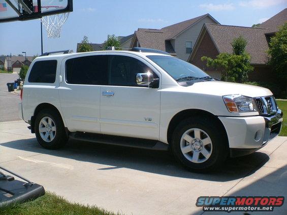 White 2006 Nissan Armada parked in driveway, 3/4 front view