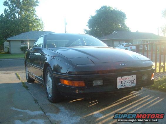 Black 1991 Ford Probe GT Turbo coupe with pop-up headlights