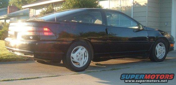 1991 Ford Probe coupe parked in driveway, rear quarter view