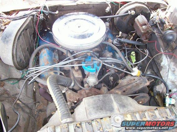 Engine bay with V8 engine, air cleaner, distributor, and brake master cylinder visible