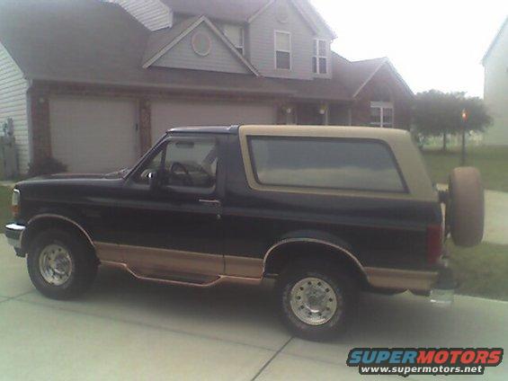 Black and tan Ford Bronco SUV parked in driveway