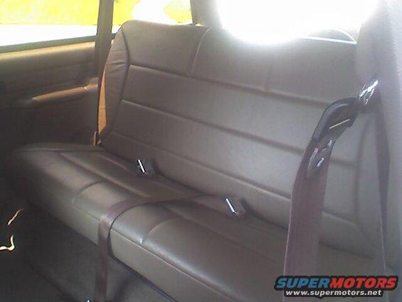 Back seat with seatbelts in a vehicle