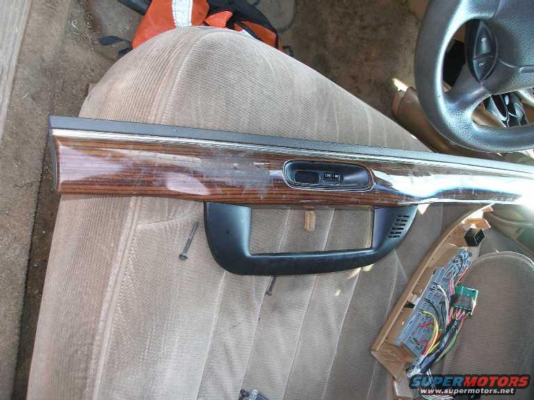 dash-panel.jpg Woodgrain dash panel with clock. The clock can be installed in P71s. 

Also note the driver's door and window switches. Ideal if any of your switches have burned out or if you want to use the LEDs to illuminate a P71's switches.