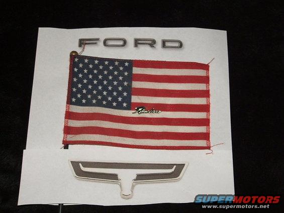 Ford nameplate, American flag, and a Ford emblem