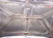 1979 Ford Bronco - The underside of a car hood shows signs of rust and wear.