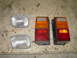 1995 Jeep YJ - A pair of rectangular headlights and two Jeep YJ taillights are displayed on a textured surface.