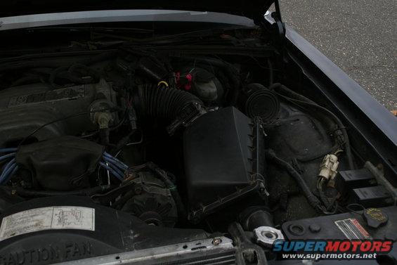 Engine bay with air intake and wiring
