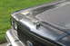 1989 Ford Crown Victoria LTD - The hood ornament is a leaping cat, and the paint on the hood is significantly weathered.