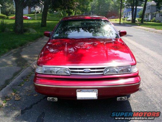 1995 Ford Crown Victoria front view, red paint, Massachusetts license plate