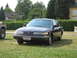 1992 Ford Crown Victoria - 1992 Ford Crown Victoria parked on grass with a Jeep to its left.