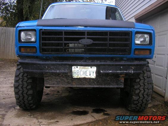 Blue 1983 Ford Bronco front view with lifted suspension and large tires