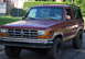 1979 Ford F-250 - Maroon Ford Bronco II, likely from the late 1980s, is seen from the front 3/4 angle.