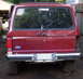 1979 Ford F-250 - Rear view of a red Ford Bronco II, showing its tailgate, bumper, and taillights.