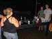 1986 Ford Mustang - Party scene with people playing beer pong at night.