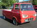 1963 Ford E100 - This 1961 Ford Econoline pickup truck is red and features an Oregon license plate.