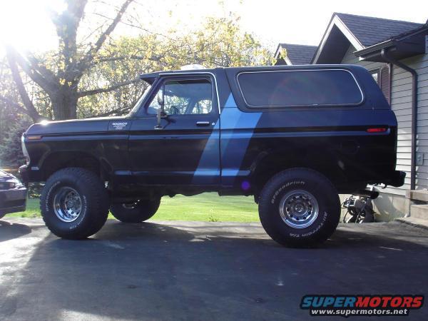 1979 Ford Bronco side profile with blue stripe detail