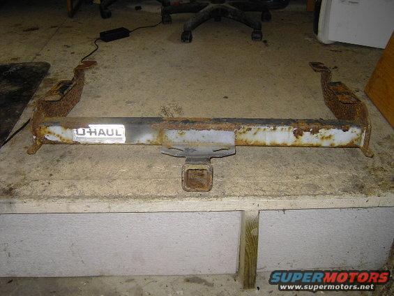 Rusty trailer hitch with U-Haul label