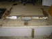 1995 Jeep YJ - This rusty trailer hitch, bearing a U-Haul label, is presented for identification. No vehicle year is discernible from the part itself.